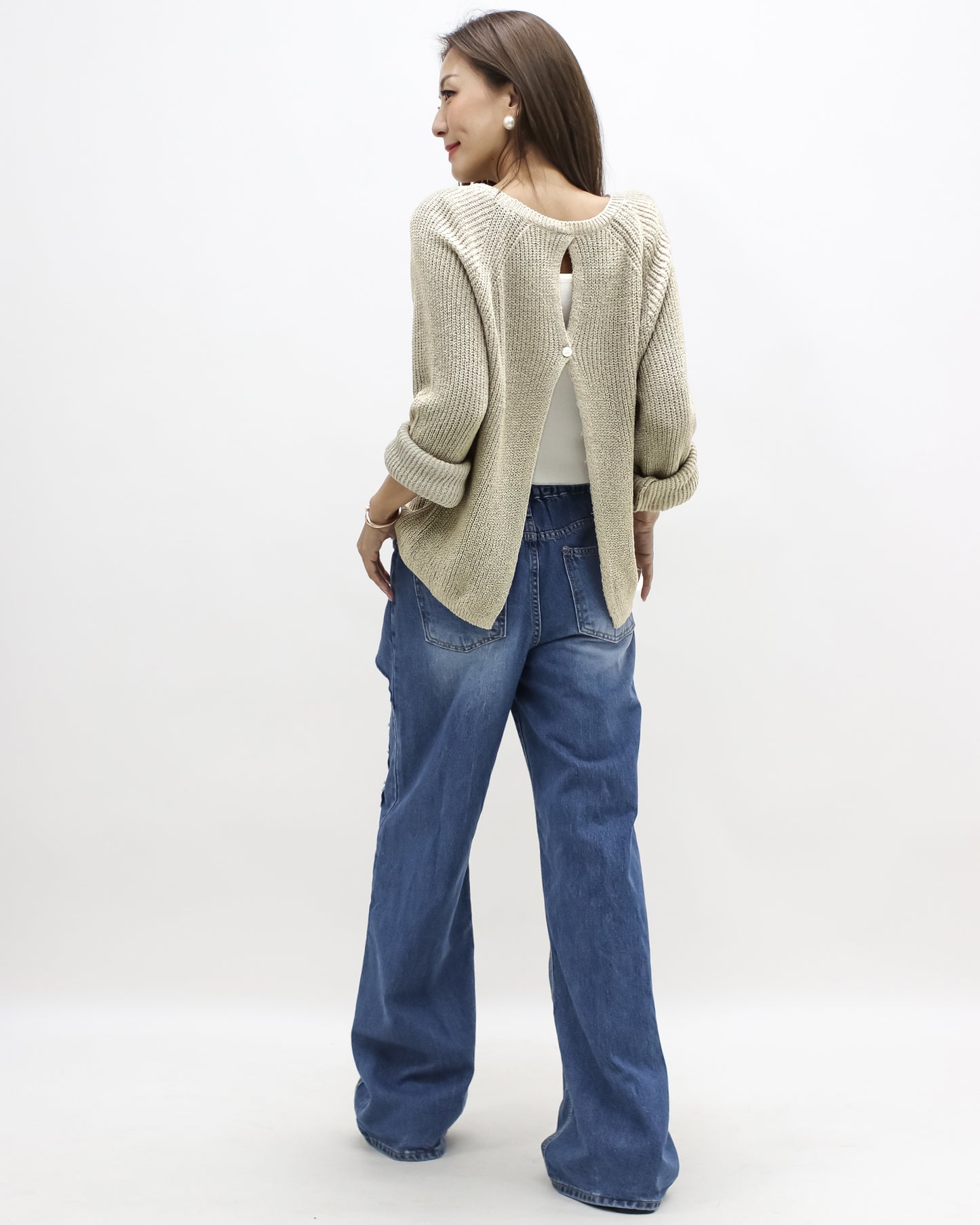 beige open back knitted top
