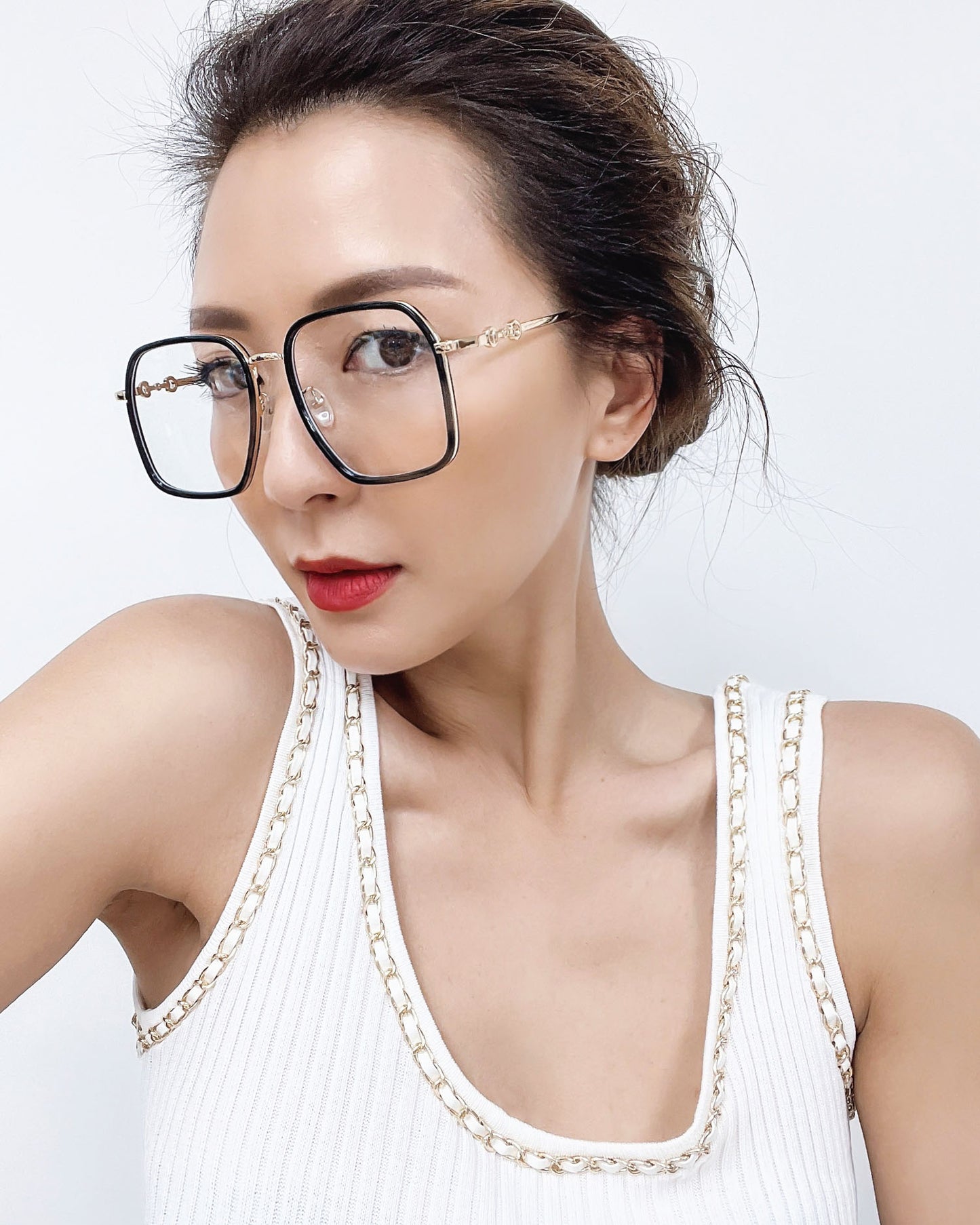 black frame with gold amrs clear lens glasses