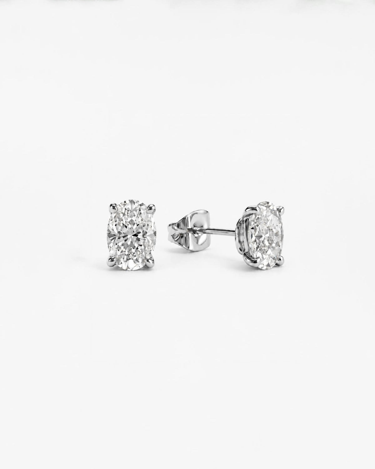 0.7ct oval lab grown diamond rhodium plated alloy studded earrings