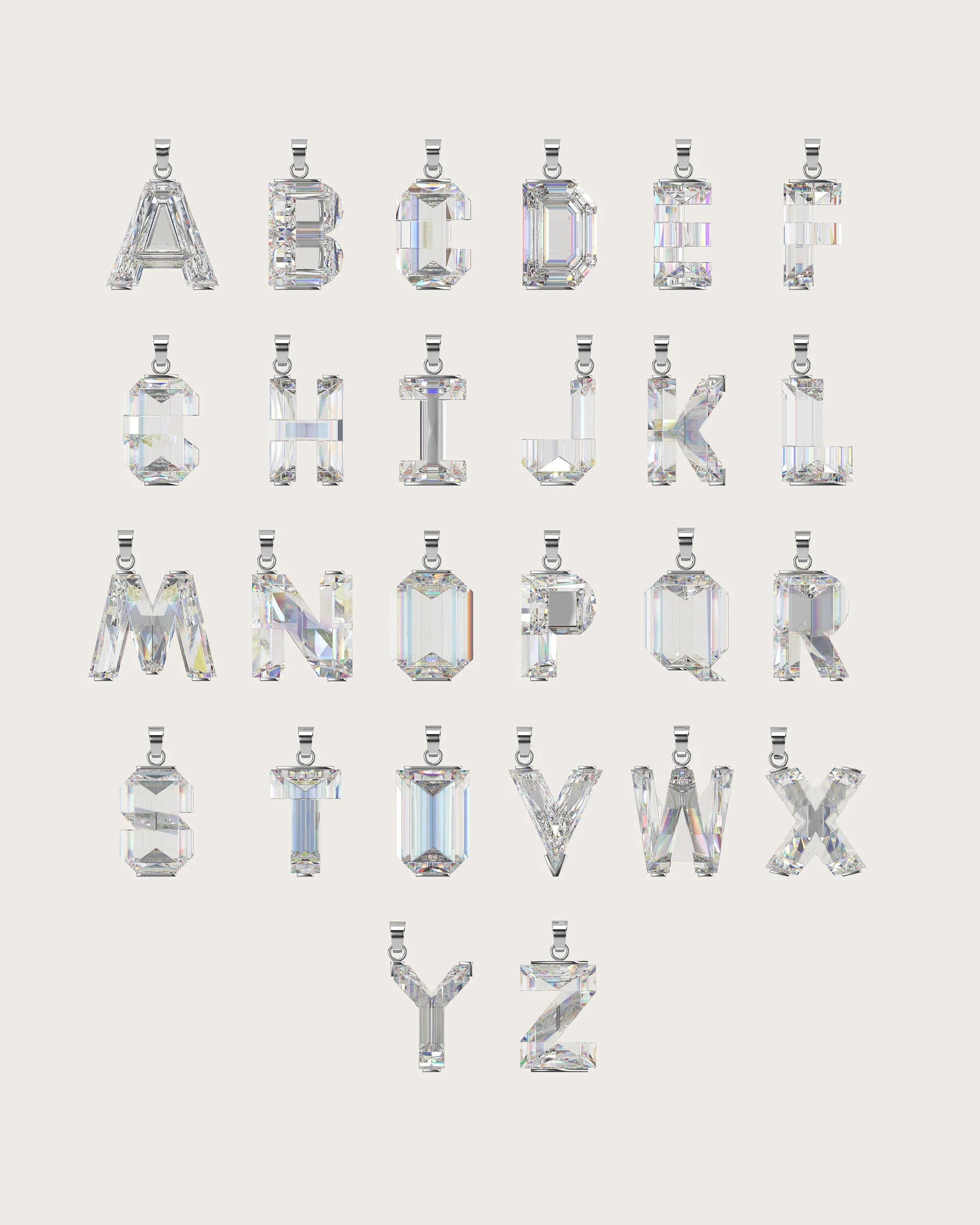 A set of alphabet letters from A to Z, each cut and shaped like a clear faceted gemstone pendant, arranged in rows on a light warm gray background.