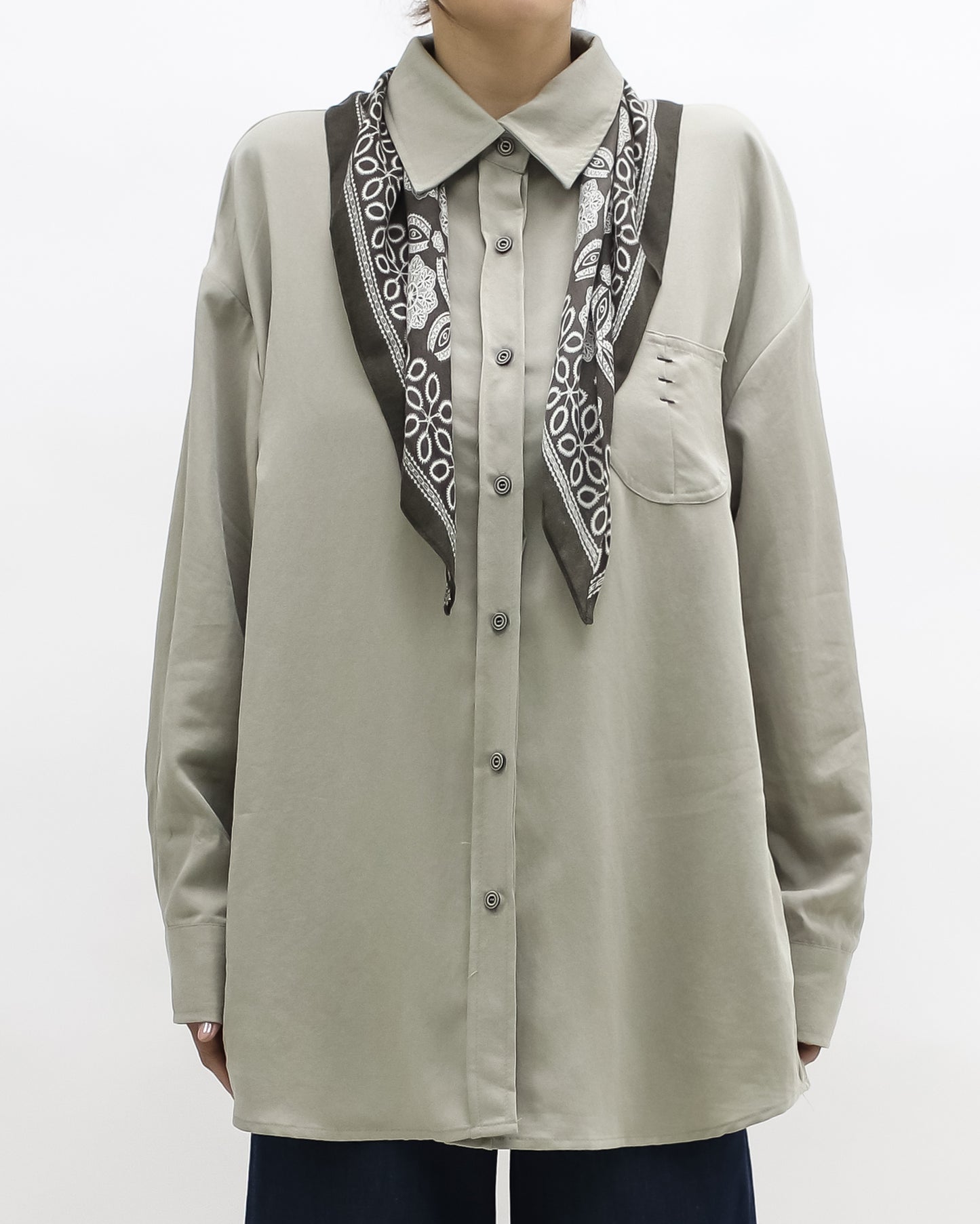 beige shirt w/ green printed scarf