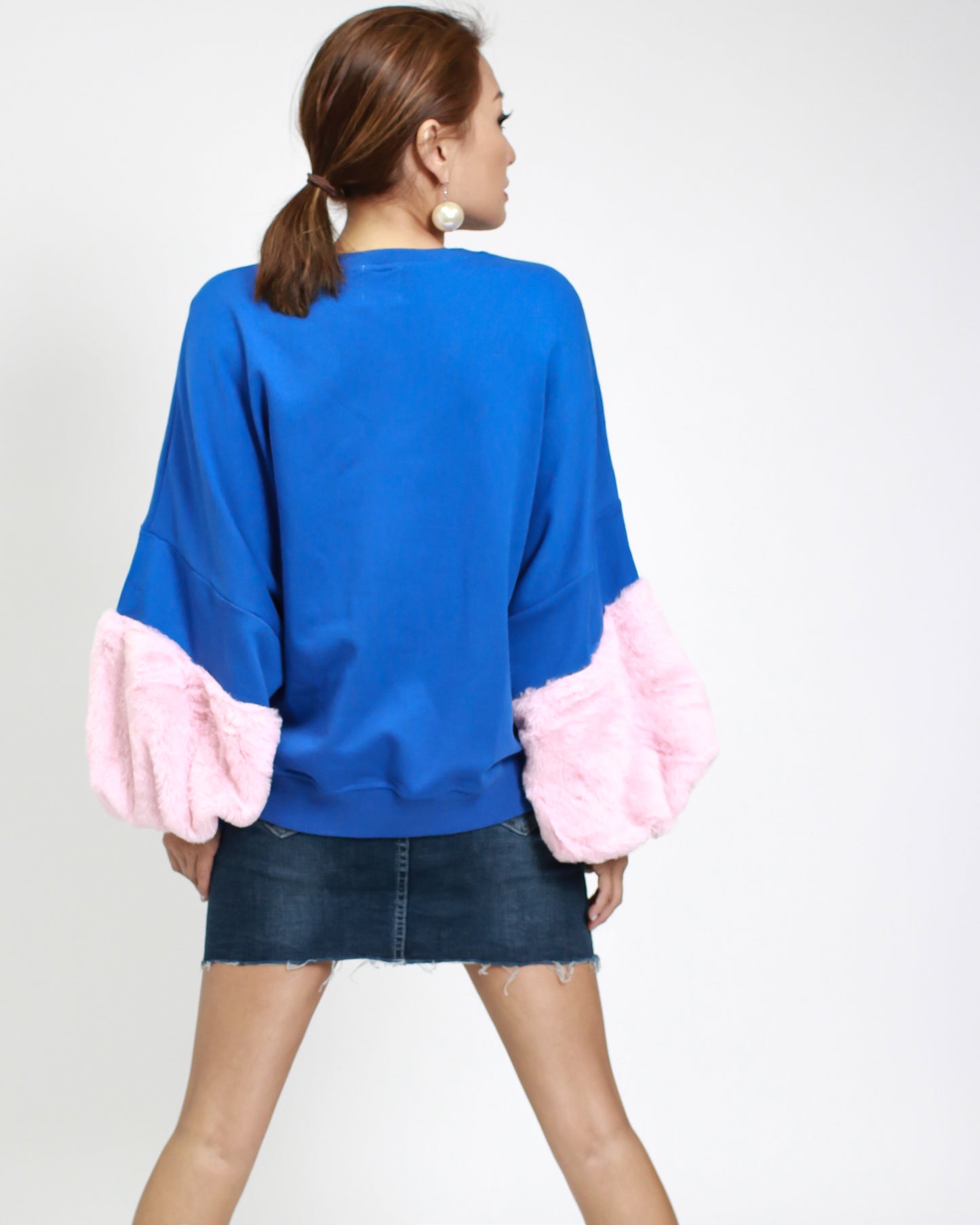 blue sweatshirt with pink furry sleeves